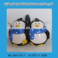 Creative ceramic utensil holder with penguin design